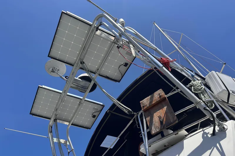 Slide: The Image of Solar panels on Jeanneau Sun Odyssey 469 sailboat, 2015 model, under clear blue sky. - 36