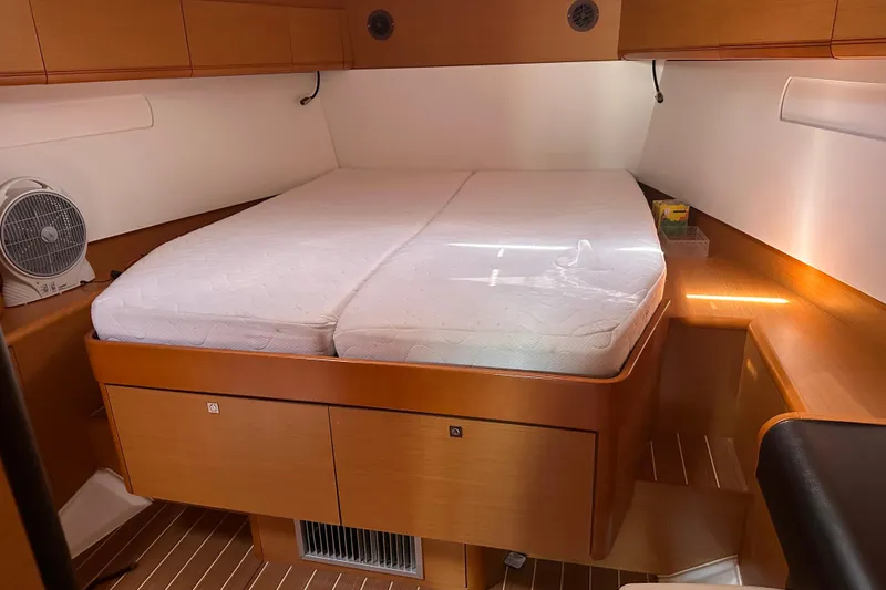 Slide: The Image of Cozy cabin interior of 2015 Jeanneau Sun Odyssey 469 sailboat with double bed. - 9