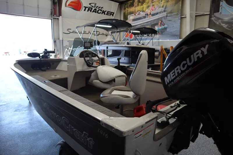 Slide: The Image of 2013 MirroCraft 1416 Troller boat with Mercury engine in showroom. - 10