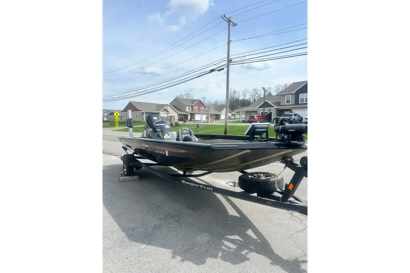 Slide: The Image of 2016 Ranger RT188 boat on trailer in suburban neighborhood street. - 6