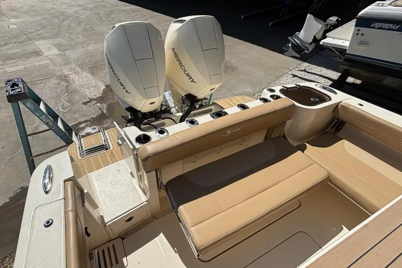 Slide: The Image of 2024 Scout 255 Dorado boat with Mercury engines, beige interior. - 10