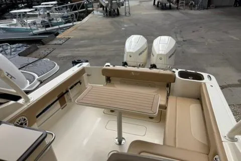 Slide: The Image of 2024 Scout 255 Dorado boat interior with seating and dual engines. - 14