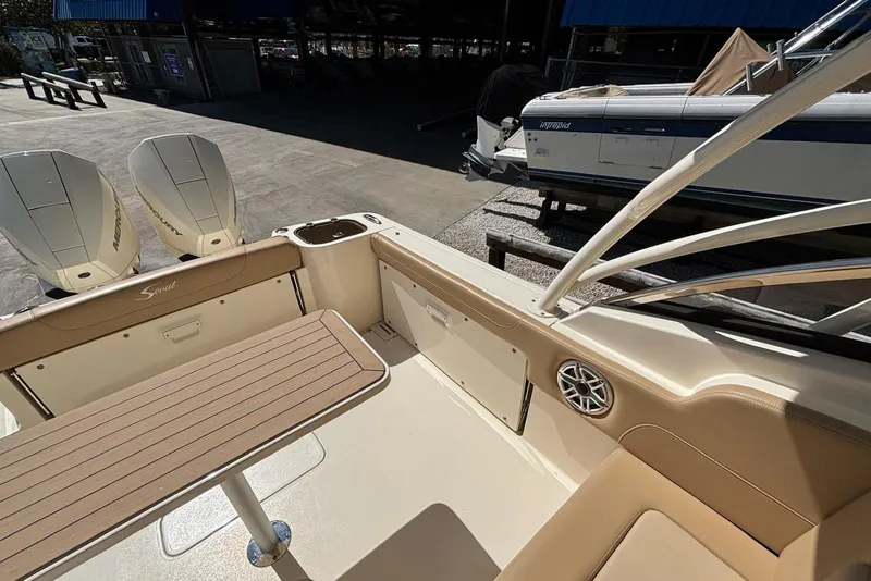 Slide: The Image of 2024 Scout 255 Dorado boat interior with seating and dual outboard motors. - 15