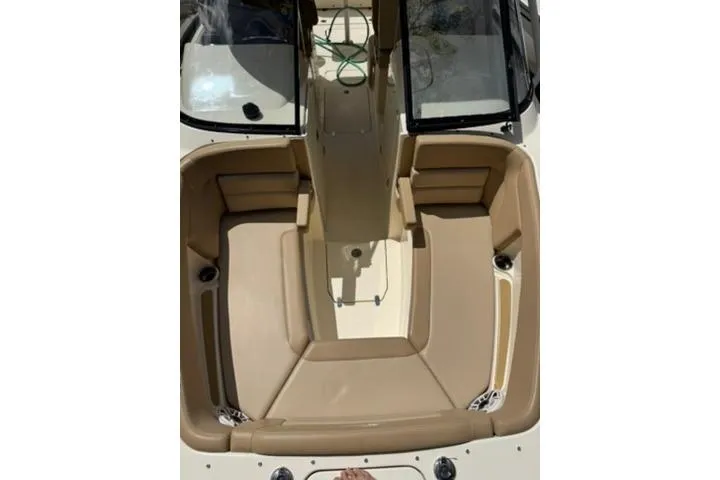 Slide: The Image of 2024 Scout 255 Dorado boat interior with tan seating and open deck layout. - 35