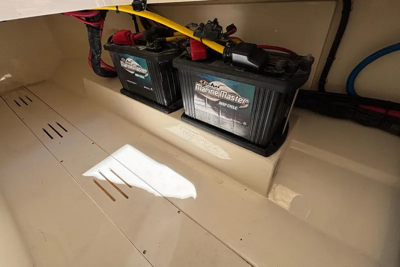 Slide: The Image of 2024 Scout 255 Dorado boat battery compartment with Marine Master deep cycle batteries. - 41