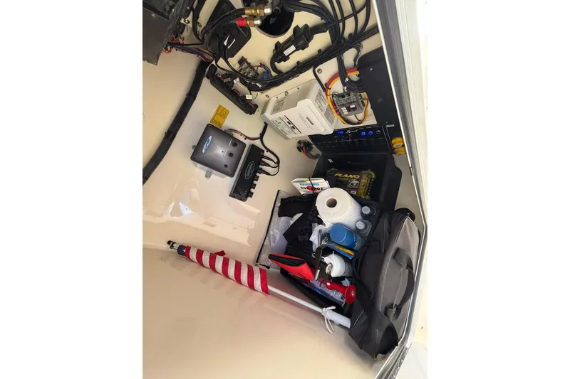 Slide: The Image of Interior storage of 2024 Scout 255 Dorado boat with equipment and supplies. - 42