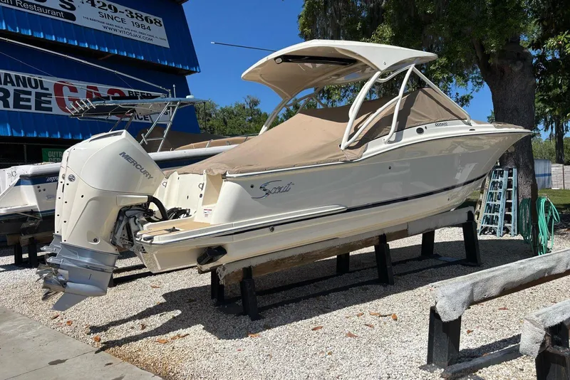 Slide: The Image of 2024 Scout 255 Dorado boat with Mercury engine displayed outdoors. - 45