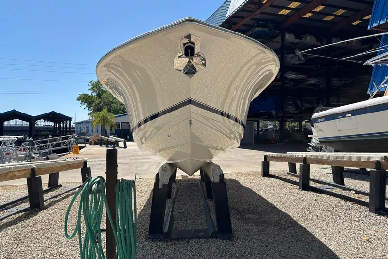 Slide: The Image of 2024 Scout 255 Dorado boat on display at a marina, front view. - 5