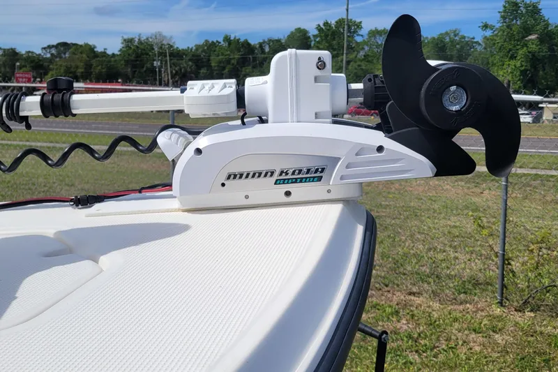 Slide: The Image of Minn Kota Riptide motor on 2013 Key West 172 SE boat, parked outdoors. - 5