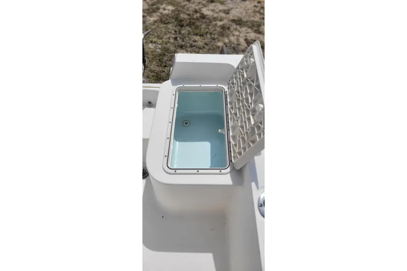 Slide: The Image of Open storage compartment on a 2013 Key West 172 SE boat. - 6