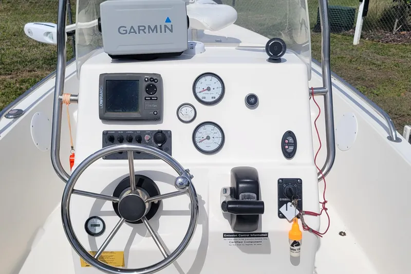 Slide: The Image of 2013 Key West 172 SE boat dashboard with Garmin GPS and Lowrance fish finder. - 8