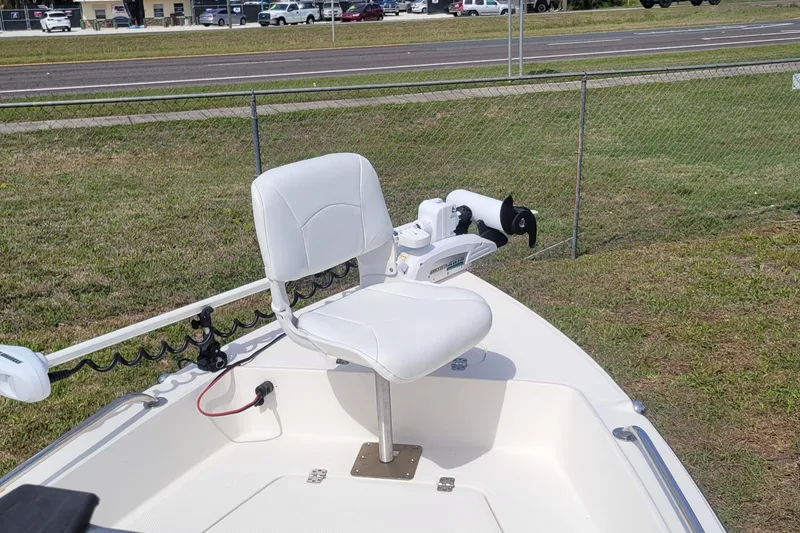 Slide: The Image of 2013 Key West 172 SE boat with white swivel seat and trolling motor. - 9