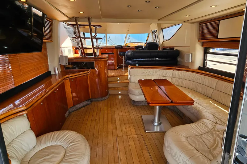 Slide: The Image of Luxurious interior of a 1998 Sunseeker Manhattan 62 yacht with elegant wood finishes. - 12
