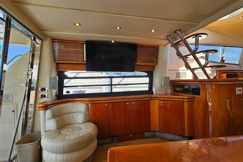Slide: The Image of Luxurious interior of a 1998 Sunseeker Manhattan 62 yacht with wood finishes and modern amenities. - 13