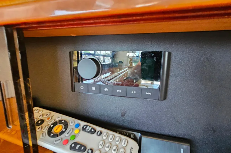 Slide: The Image of Audio control panel and remote inside a 1998 Sunseeker Manhattan 62 yacht. - 18