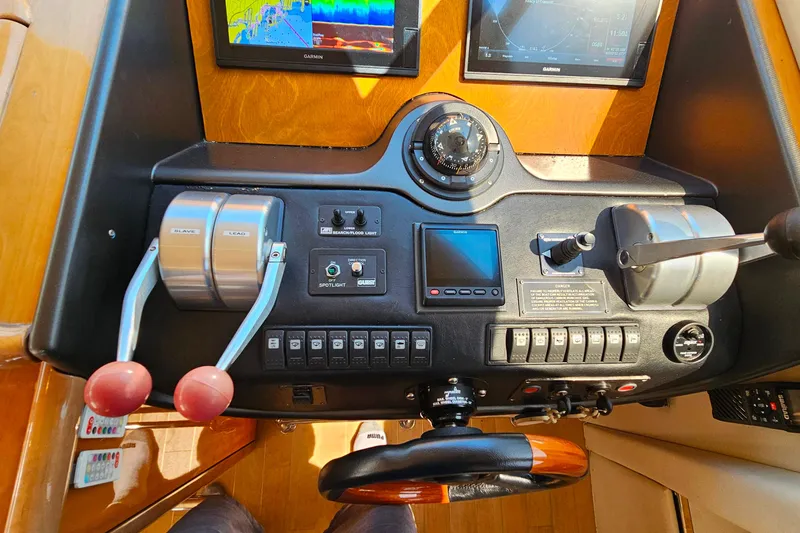 Slide: The Image of Control panel of a 1998 Sunseeker Manhattan 62 yacht with navigation instruments. - 23