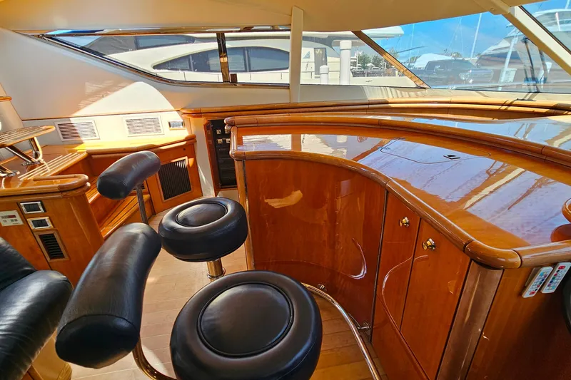 Slide: The Image of Luxurious interior of 1998 Sunseeker Manhattan 62 yacht with polished wood and leather seating. - 28