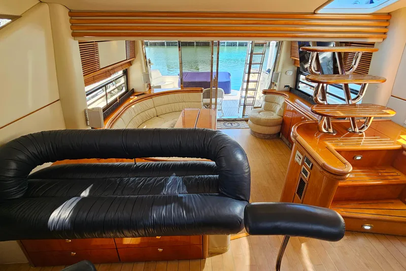 Slide: The Image of Luxurious interior of 1998 Sunseeker Manhattan 62 yacht with elegant seating and wood finishes. - 29