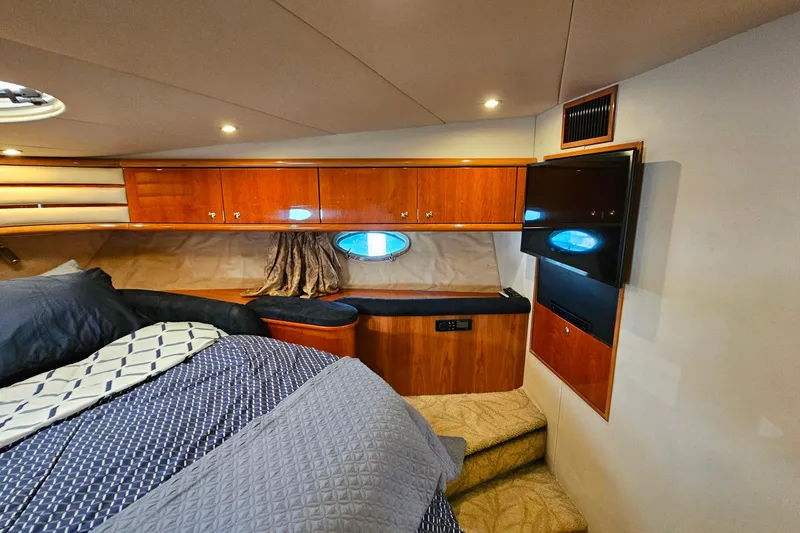 Slide: The Image of Luxurious cabin interior of 1998 Sunseeker Manhattan 62 yacht with cozy bedding and wood finishes. - 38