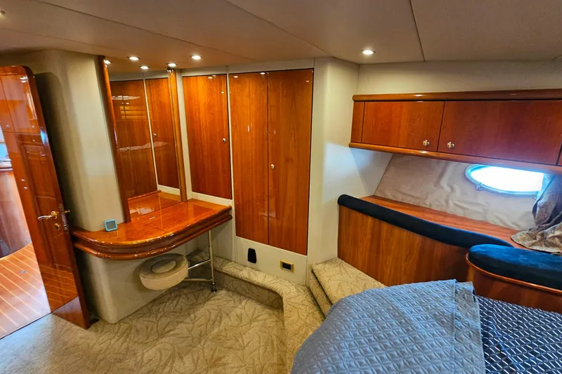 Slide: The Image of Luxurious cabin interior of a 1998 Sunseeker Manhattan 62 yacht with wood finishes. - 42