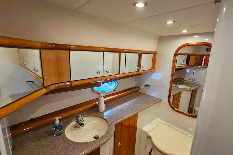 Slide: The Image of Luxurious bathroom interior of 1998 Sunseeker Manhattan 62 yacht with wood accents. - 43