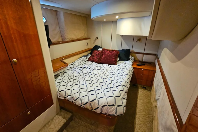 Slide: The Image of Luxurious cabin interior of a 1998 Sunseeker Manhattan 62 yacht with elegant bedding. - 45