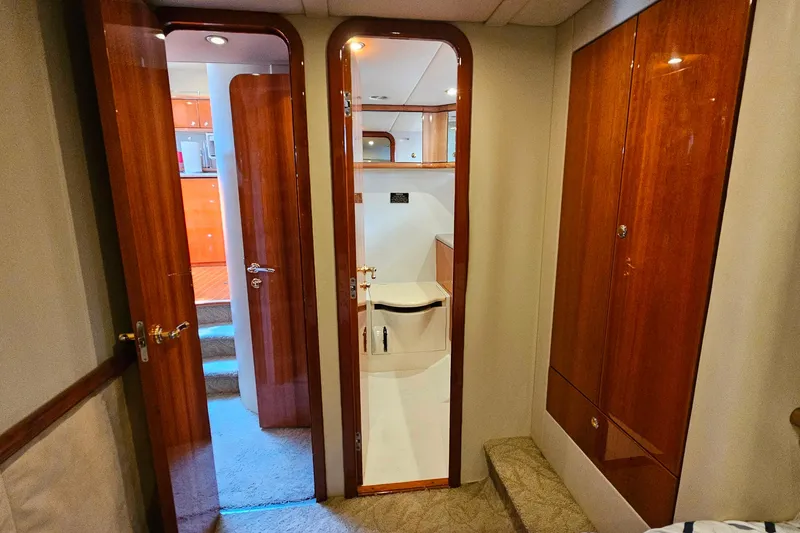 Slide: The Image of Interior of 1998 Sunseeker Manhattan 62 yacht with wooden doors and carpeted flooring. - 46