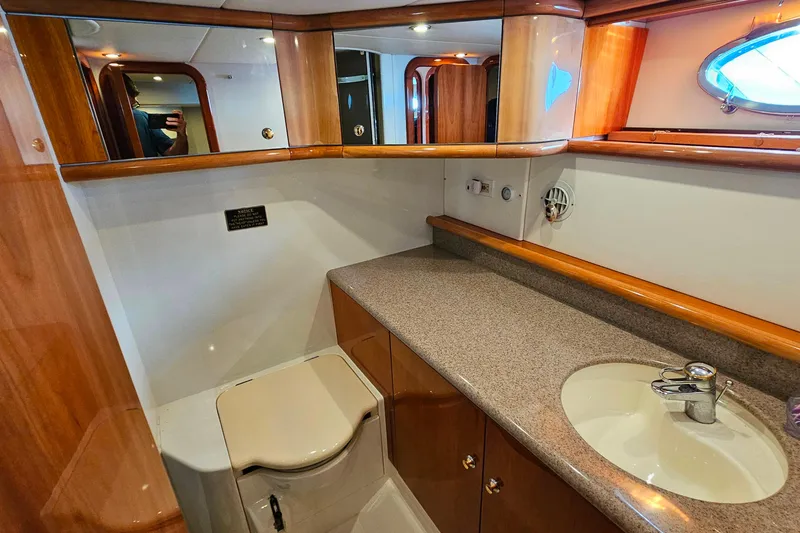 Slide: The Image of Luxurious bathroom interior of 1998 Sunseeker Manhattan 62 yacht with wooden cabinetry. - 47