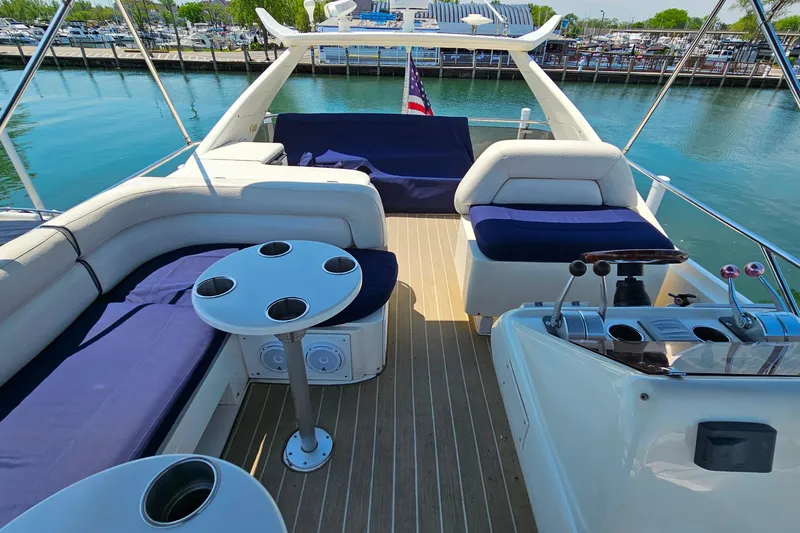 Slide: The Image of Luxurious 1998 Sunseeker Manhattan 62 yacht deck with seating and control area. - 50