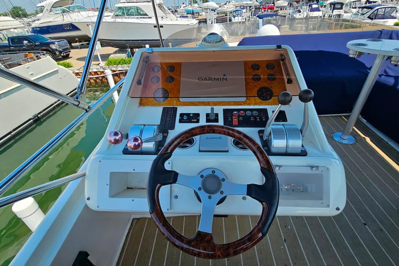Slide: The Image of Cockpit of a 1998 Sunseeker Manhattan 62 yacht with Garmin navigation system. - 57