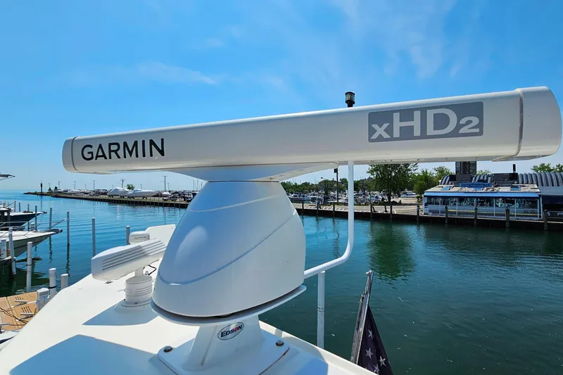 Slide: The Image of Garmin xHD2 radar on 1998 Sunseeker Manhattan 62 yacht, docked by a marina. - 59