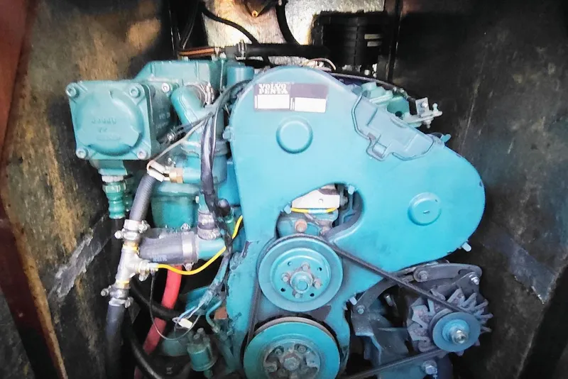 Slide: The Image of Engine of a 2003 Bavaria 49 sailboat, showcasing mechanical components. - 35