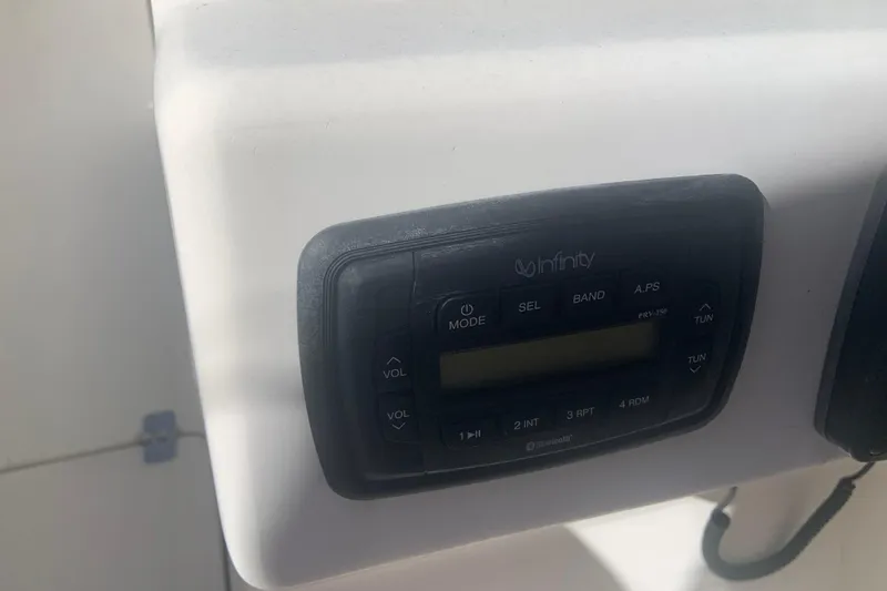 Slide: The Image of Infinity stereo system on a 2016 Key West 239 DFS boat dashboard. - 13