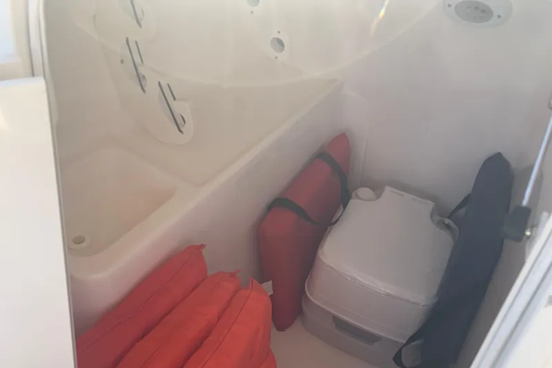 Slide: The Image of Interior of 2016 Key West 239 DFS boat with life jackets and portable toilet...which has never been used. - 25