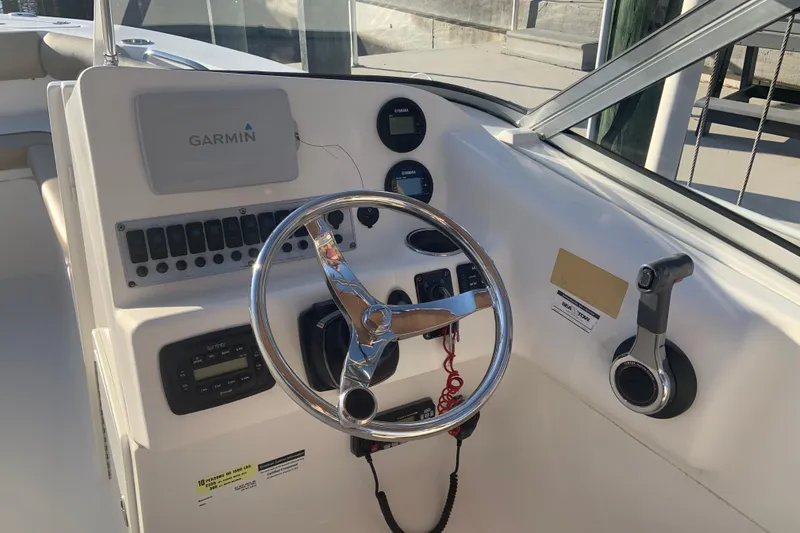 Slide: The Image of Steering console of a 2016 Key West 239 DFS boat with Garmin navigation. - 26