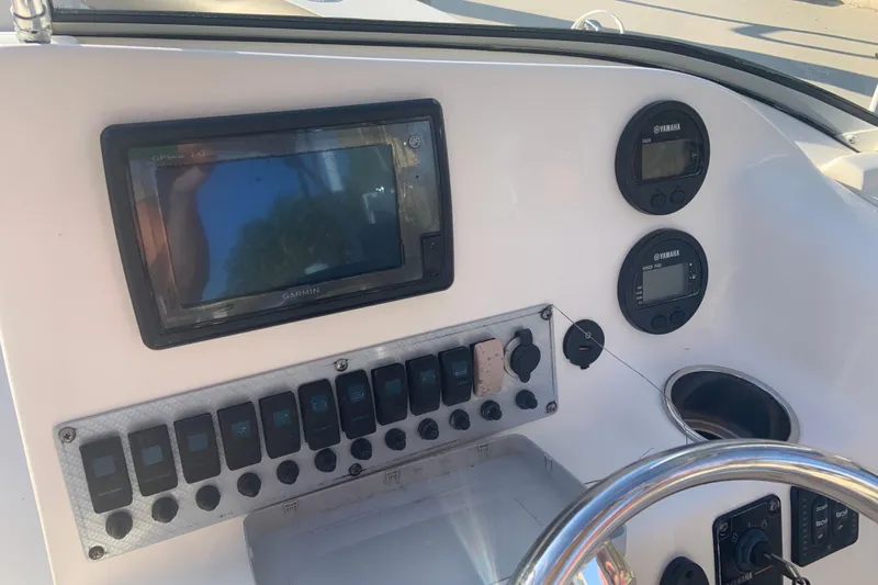 Slide: The Image of Control panel of 2016 Key West 239 DFS boat with Garmin and Yamaha displays. - 27