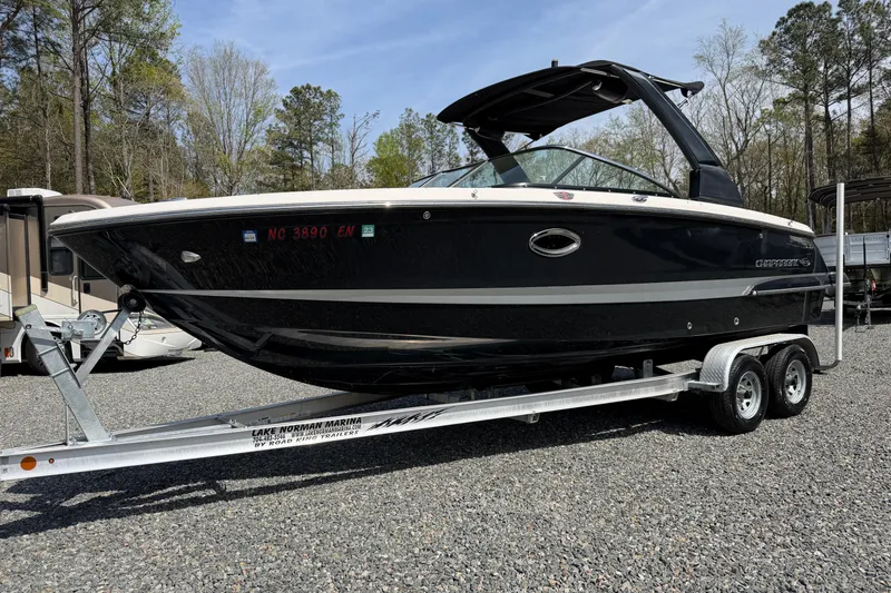 The Image of 2019 Chaparral 257 SSX boat on trailer, parked outdoors. - 1