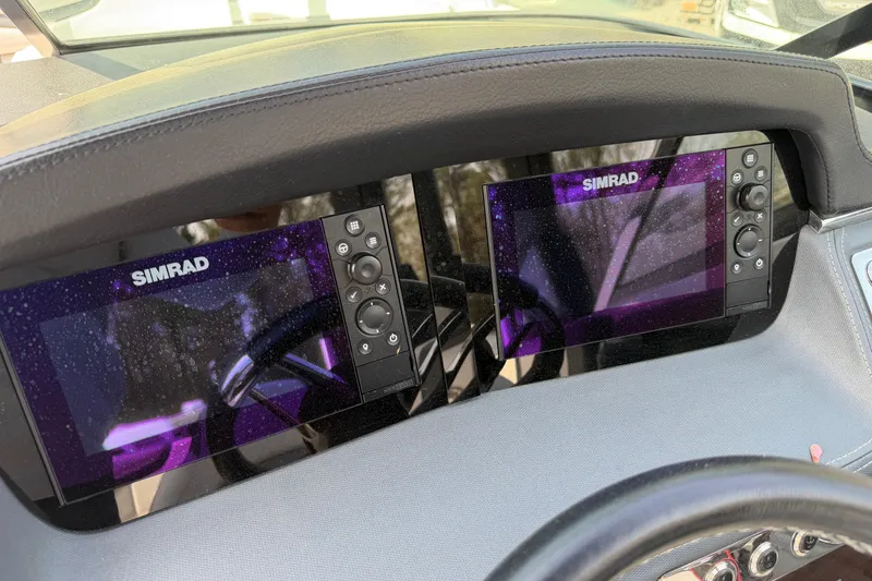 Slide: The Image of Dashboard of 2019 Chaparral 257 SSX with dual Simrad displays. - 14