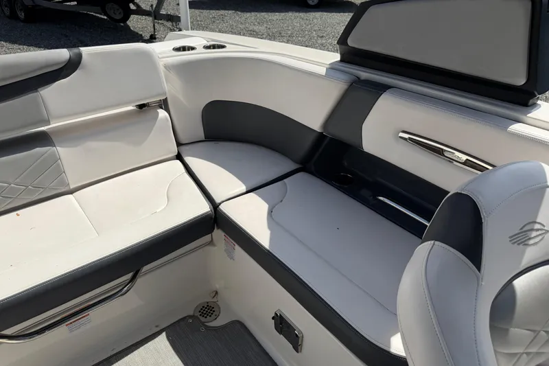 Slide: The Image of 2019 Chaparral 257 SSX boat interior with white and gray seating. - 17