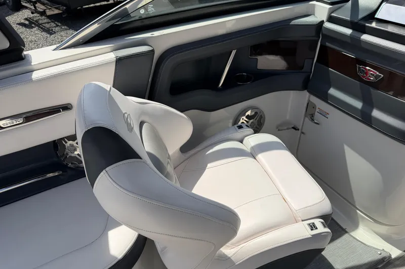 Slide: The Image of Interior of a 2019 Chaparral 257 SSX boat featuring a luxurious white seat. - 18