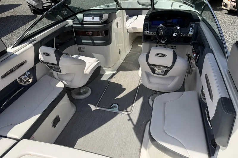 Slide: The Image of 2019 Chaparral 257 SSX boat interior with modern seating and sleek dashboard design. - 5