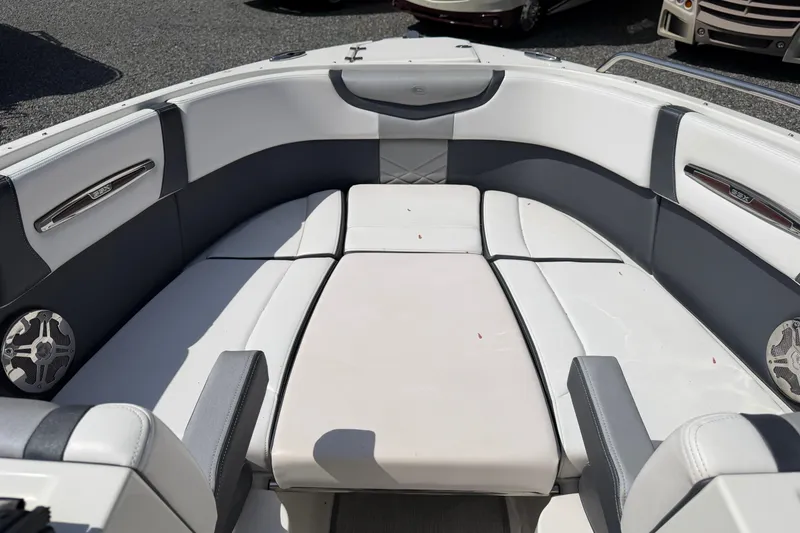 Slide: The Image of 2019 Chaparral 257 SSX boat interior with white and gray seating. - 7