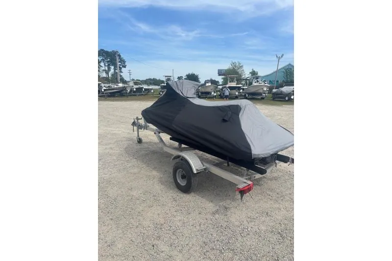 Slide: The Image of 2019 Yamaha WaveRunner EX covered on a trailer in a parking lot. - 6