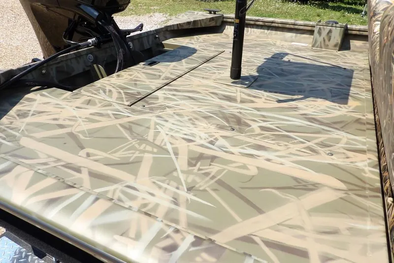 Slide: The Image of 2026 Crestliner 1760 Retriever SC boat with camouflage deck design. - 11