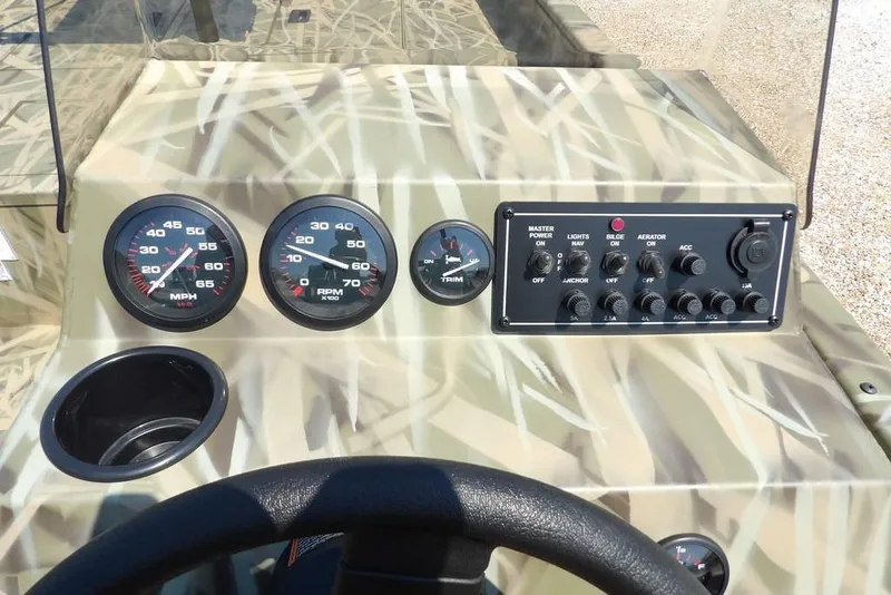 Slide: The Image of Dashboard of 2026 Crestliner 1760 Retriever SC boat with gauges and controls. - 24