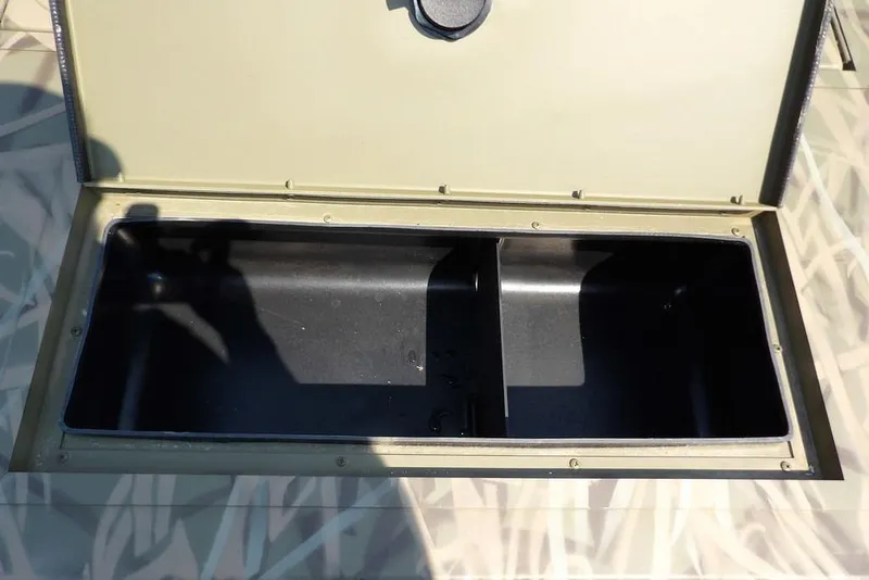 Slide: The Image of Open storage compartment in 2026 Crestliner 1760 Retriever SC boat. - 26