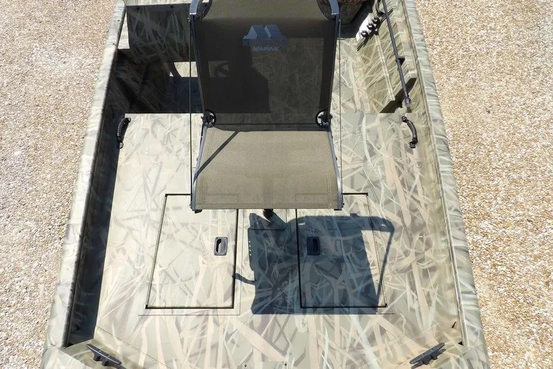 Slide: The Image of 2026 Crestliner 1760 Retriever SC boat interior with camouflage design and central seating. - 28