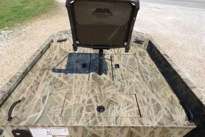 Slide: The Image of 2026 Crestliner 1760 Retriever SC boat with camouflage design and seating. - 29