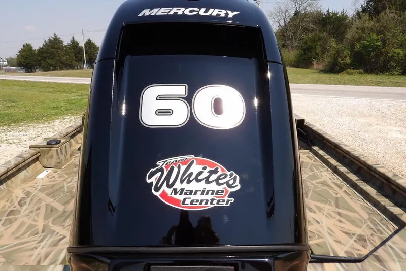 Slide: The Image of 2026 Crestliner 1760 Retriever SC with Mercury 60 engine, camo design, White's Marine Center logo. - 31