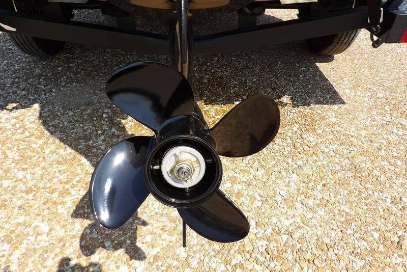 Slide: The Image of Propeller of 2026 Crestliner 1760 Retriever SC boat on gravel surface. - 32